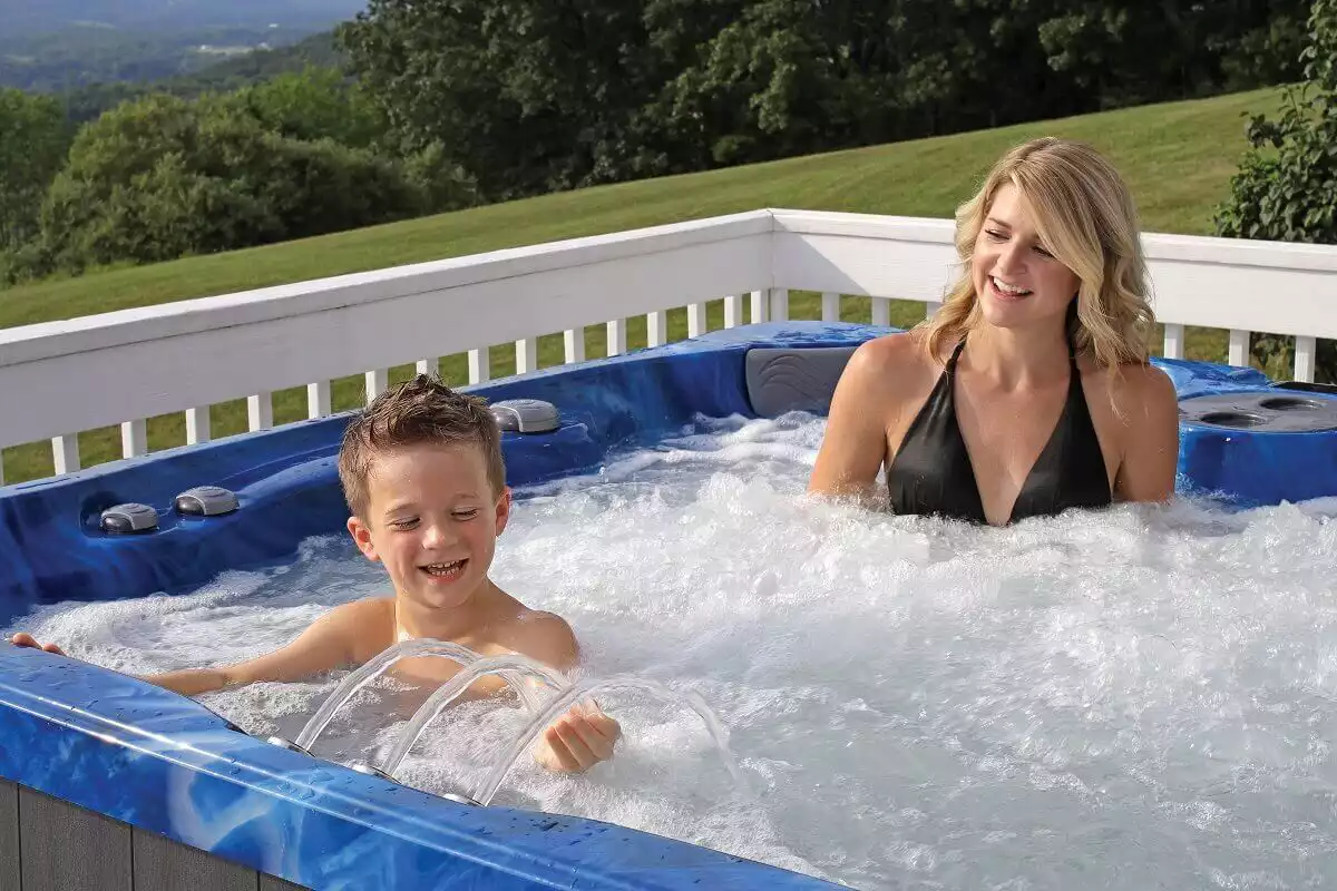 mother and son in pdc hot tub