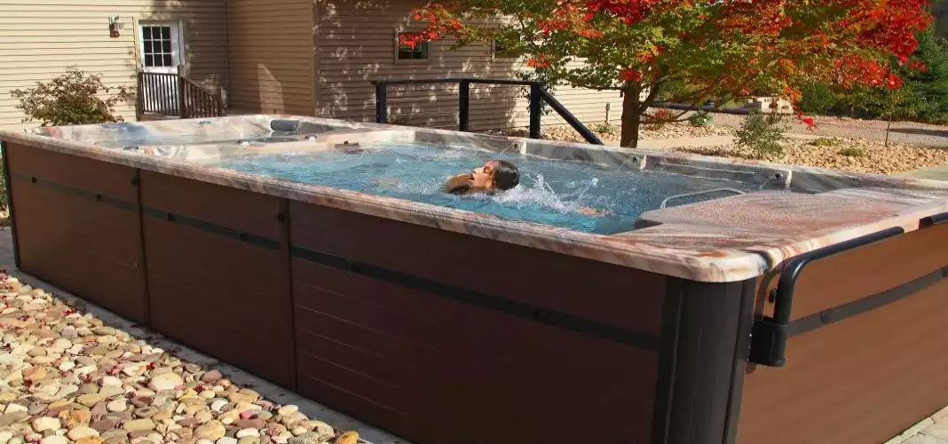 A girl swims in the PDC swim spa